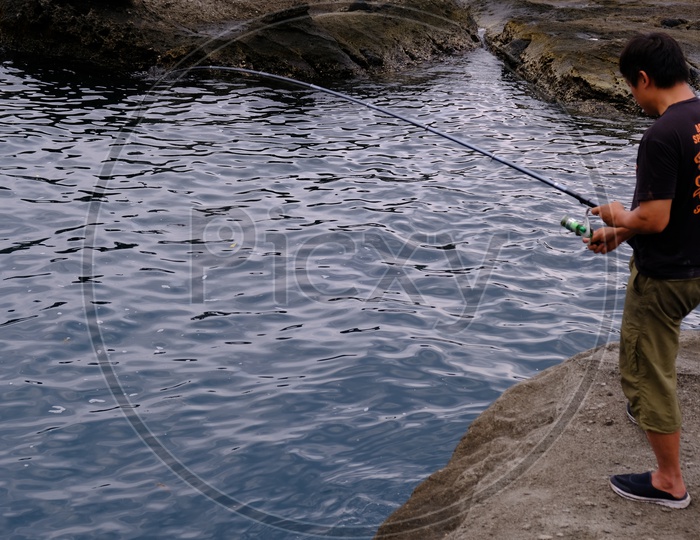 A Taiwanese Man Fishing at Dulan Beach