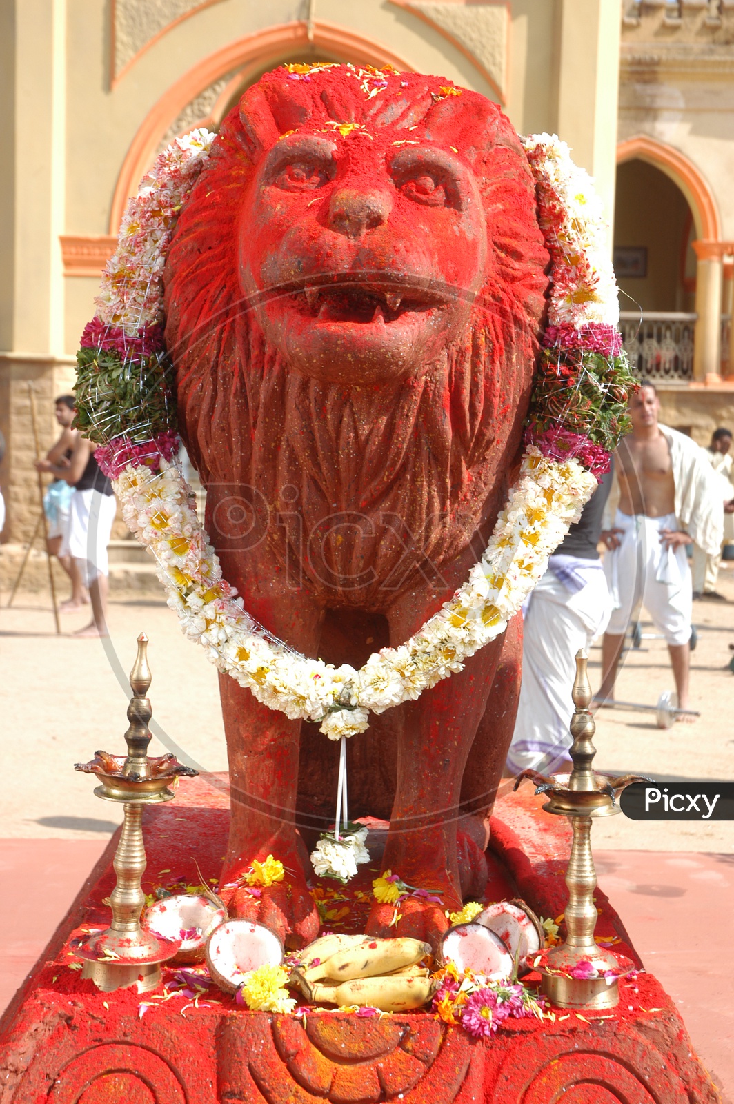 Lion Statue in front of a Bungalow