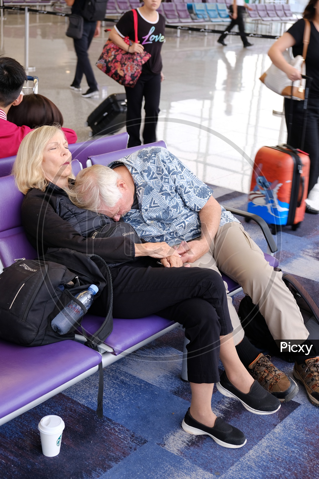 Old age Couple sleeping in Hualien Airport