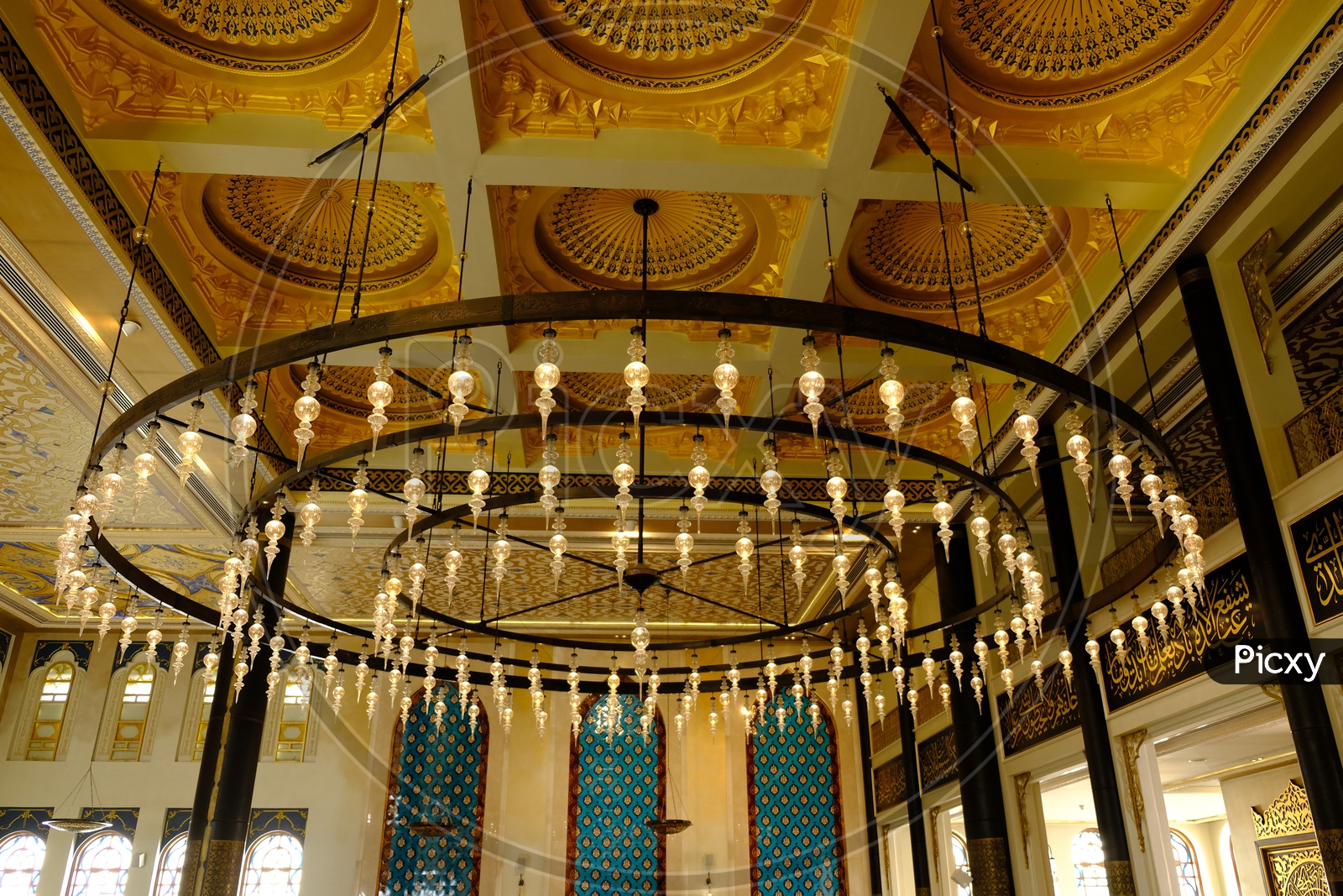 Hanging chandelier and ceiling at Katara Masjid