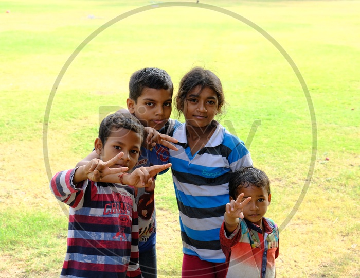 Indian  Children As a group With Smile Faces in  a Lawn Garden