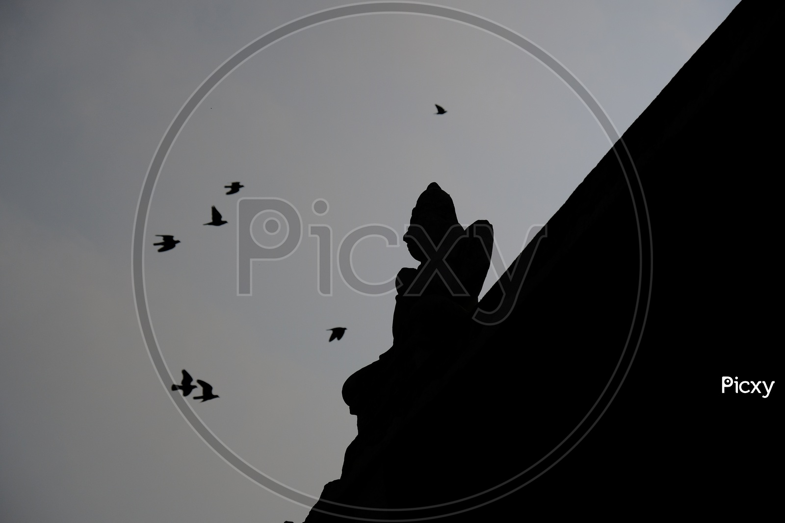 Silhouette Of Stone Carved Temple Statues