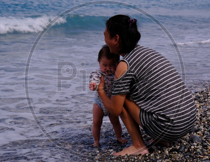 Young Mother with her Baby at Four-Eight Highland Beach