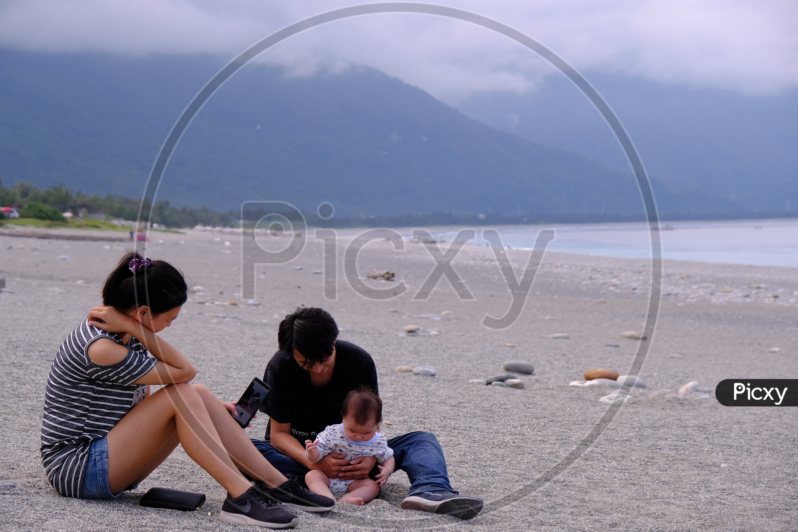 Young Couple with their Baby at Four-Eight Highland Beach