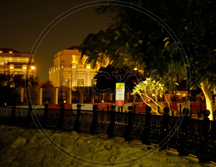 View of QIB Bank with lights during night