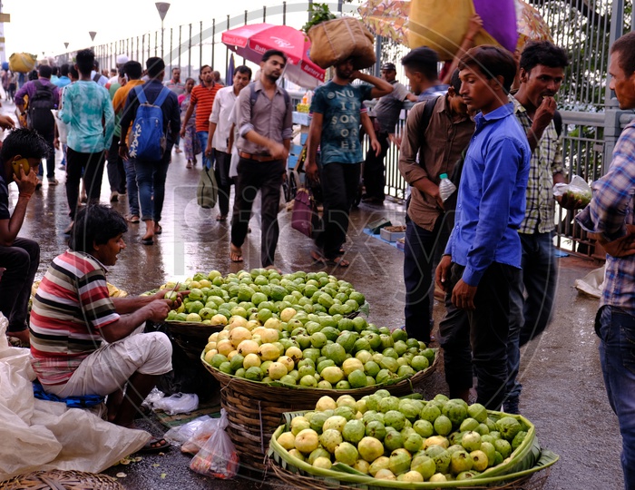 Indian Street Vendor selling guavas