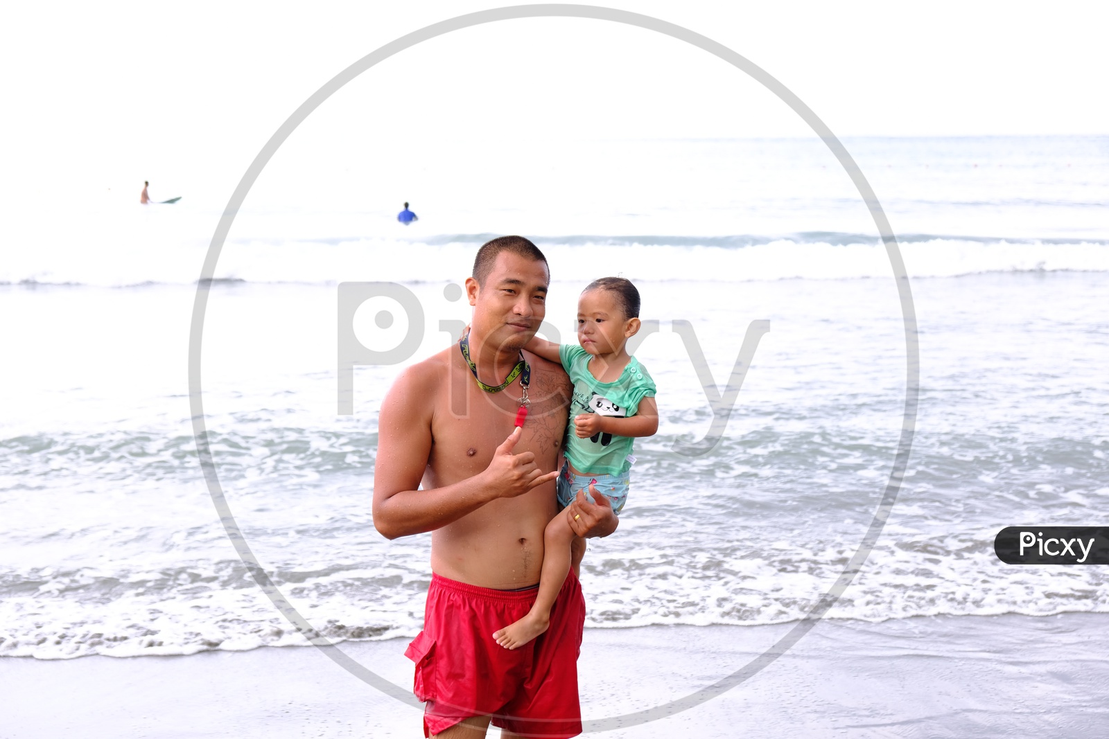 A Taiwanese Man with his Kid at Dulan Beach