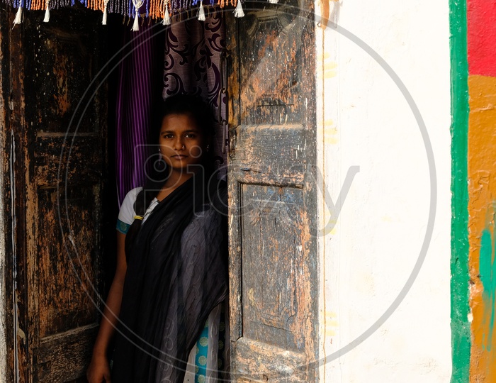 Indian Rural Village Woman at a House Door