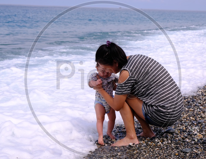 Young Mother with her Baby at Four-Eight Highland Beach