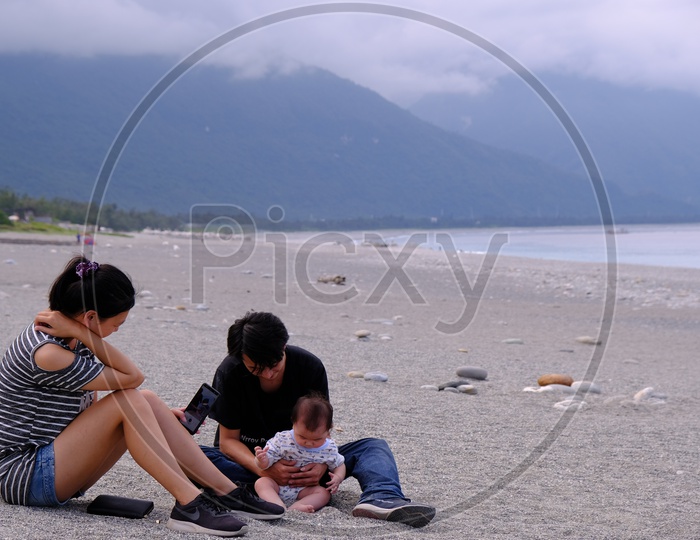 Young Couple with their Baby at Four-Eight Highland Beach