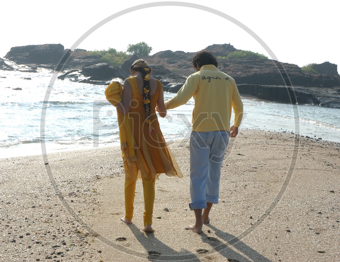 Young Indian Couple walking near Beach