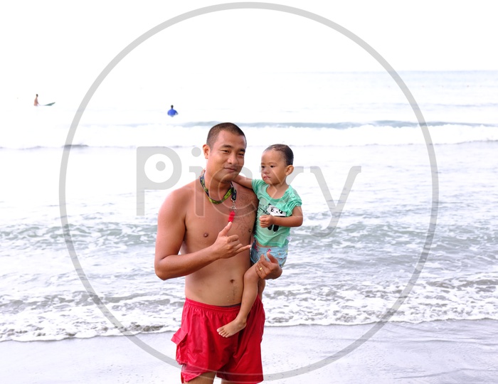 A Taiwanese Man with his Kid at Dulan Beach