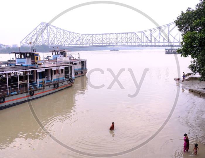 Tourist Boats in Hooghly River with Howrah Bridge in Background