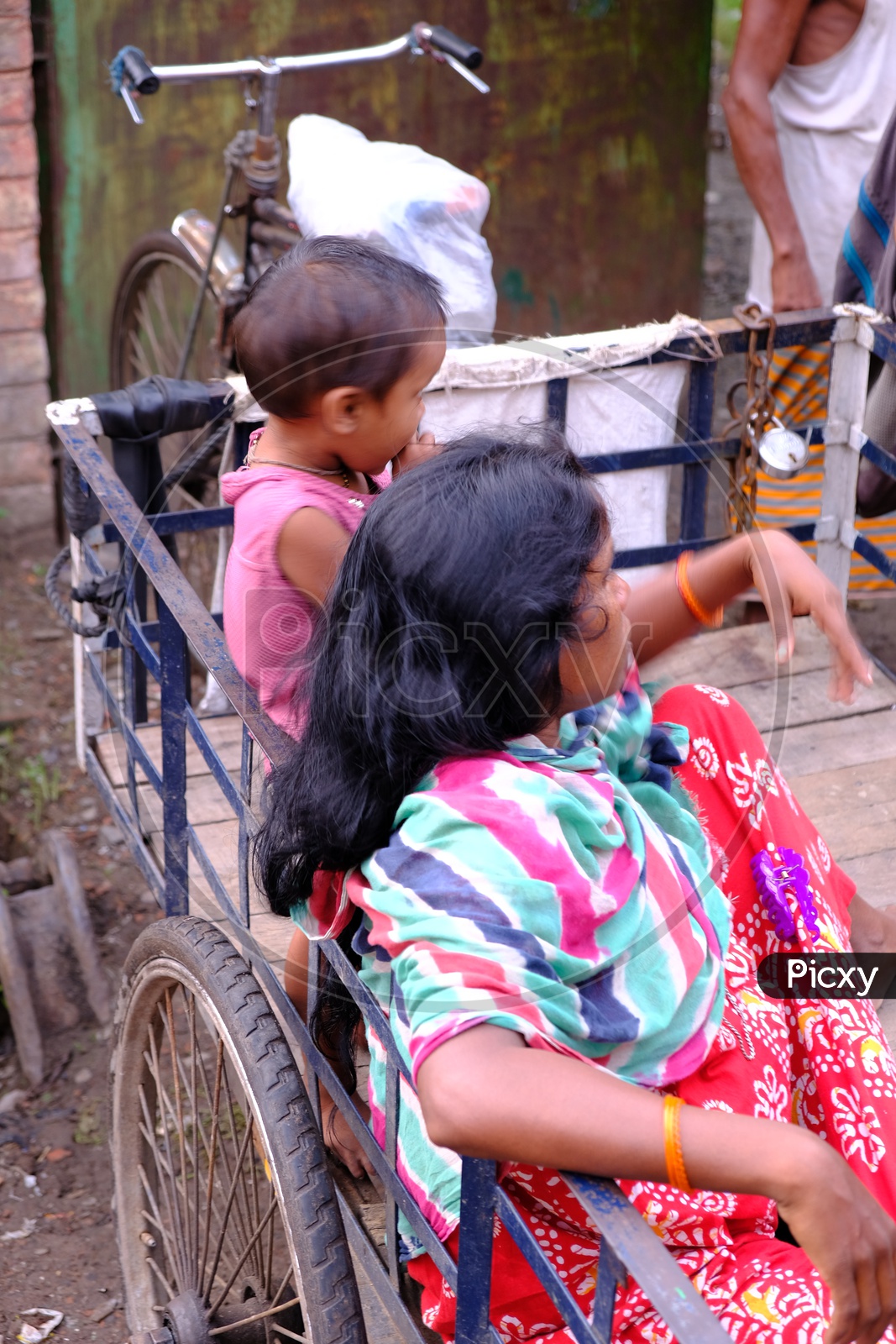 A Mother with her Child in a Rickshaw