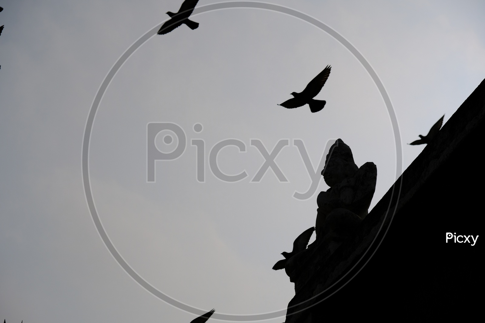 Silhouette Of Stone Carved Temple Statues