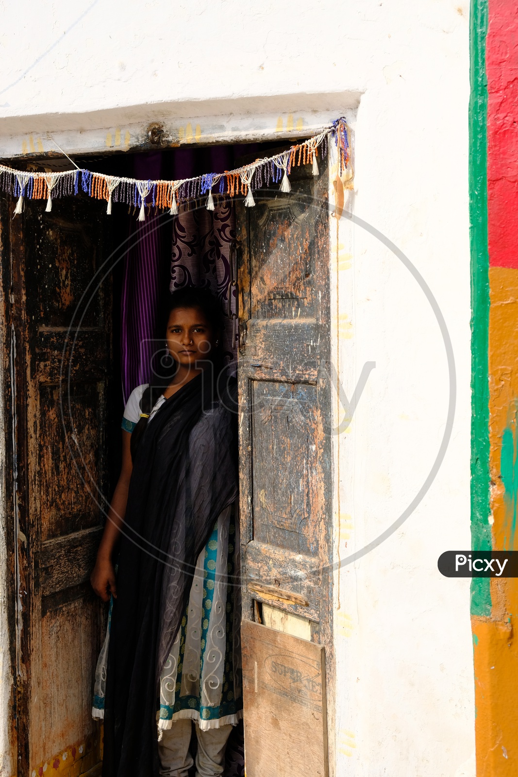 Indian Rural Village Woman at a House Door