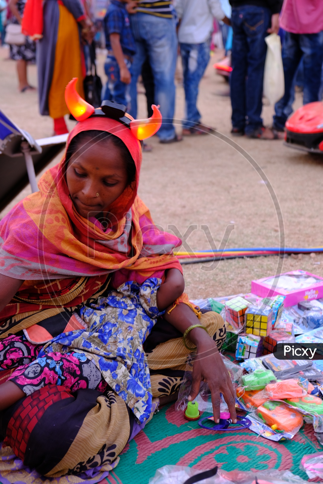 Woman Vending Toys On Footpath