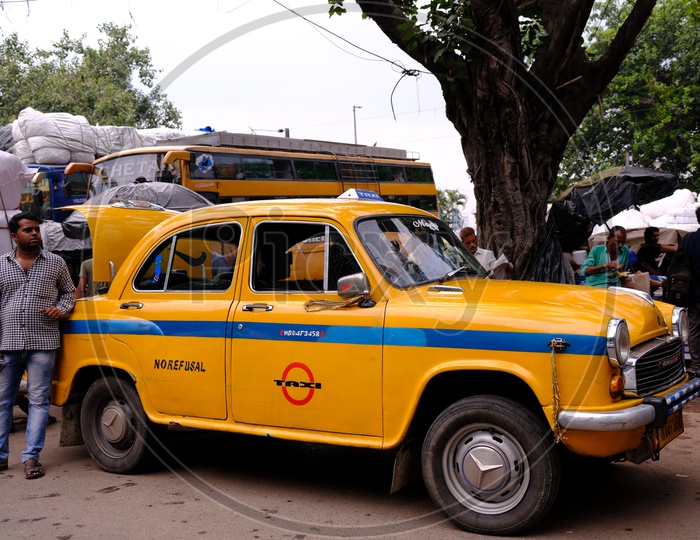 Yellow Ambassador Taxi on Kolkata Roads