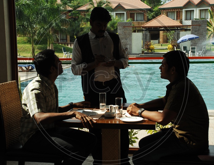 Friends in a Restaurant giving order to waiter