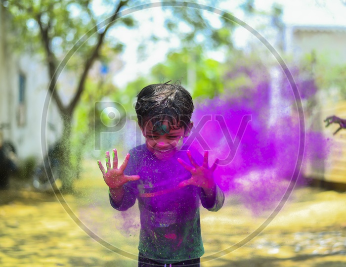 happiness of a kid while playing with colours #holi