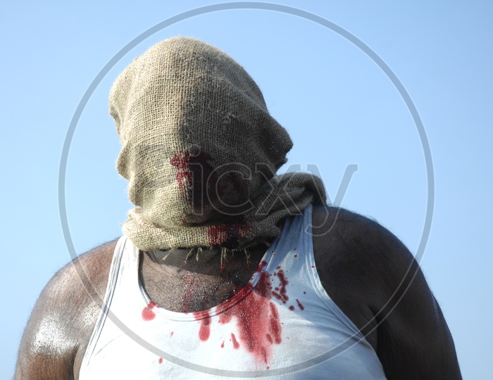 A Man Face Covered With Gunny Bag Mask And Beaten To Blood