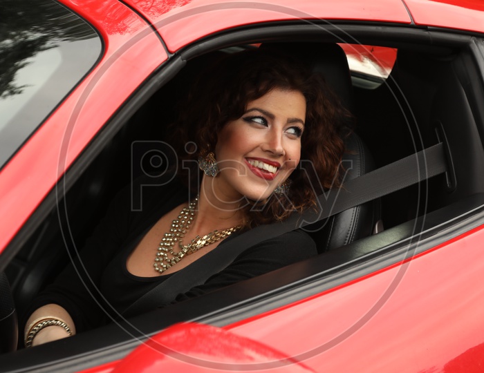 Young Woman driving Ferrari 458 Car