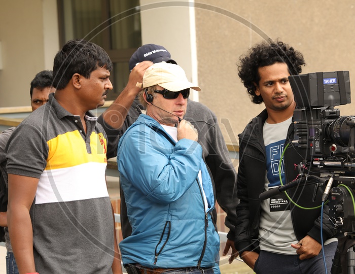 Cinematographer Behind Camera For a Movie Shooting