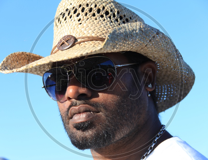 Man Wearing Cowboy Cap and Shades Sun glasses