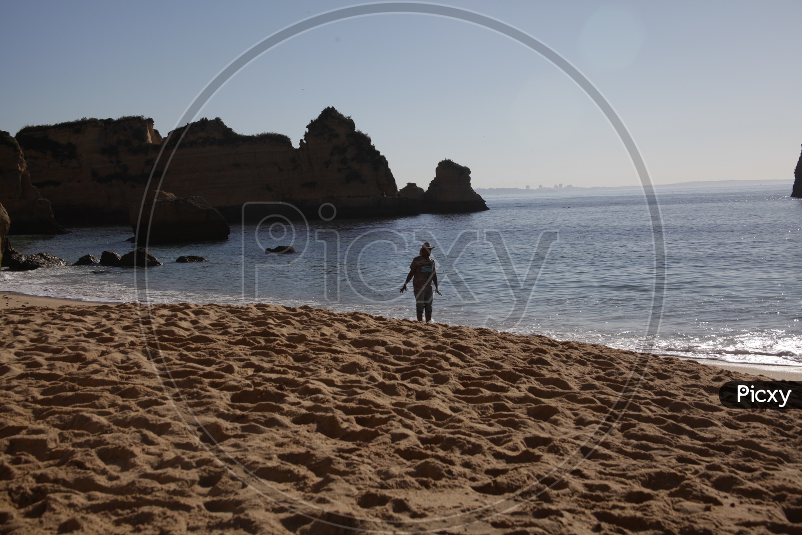 Man Standing In a Beach