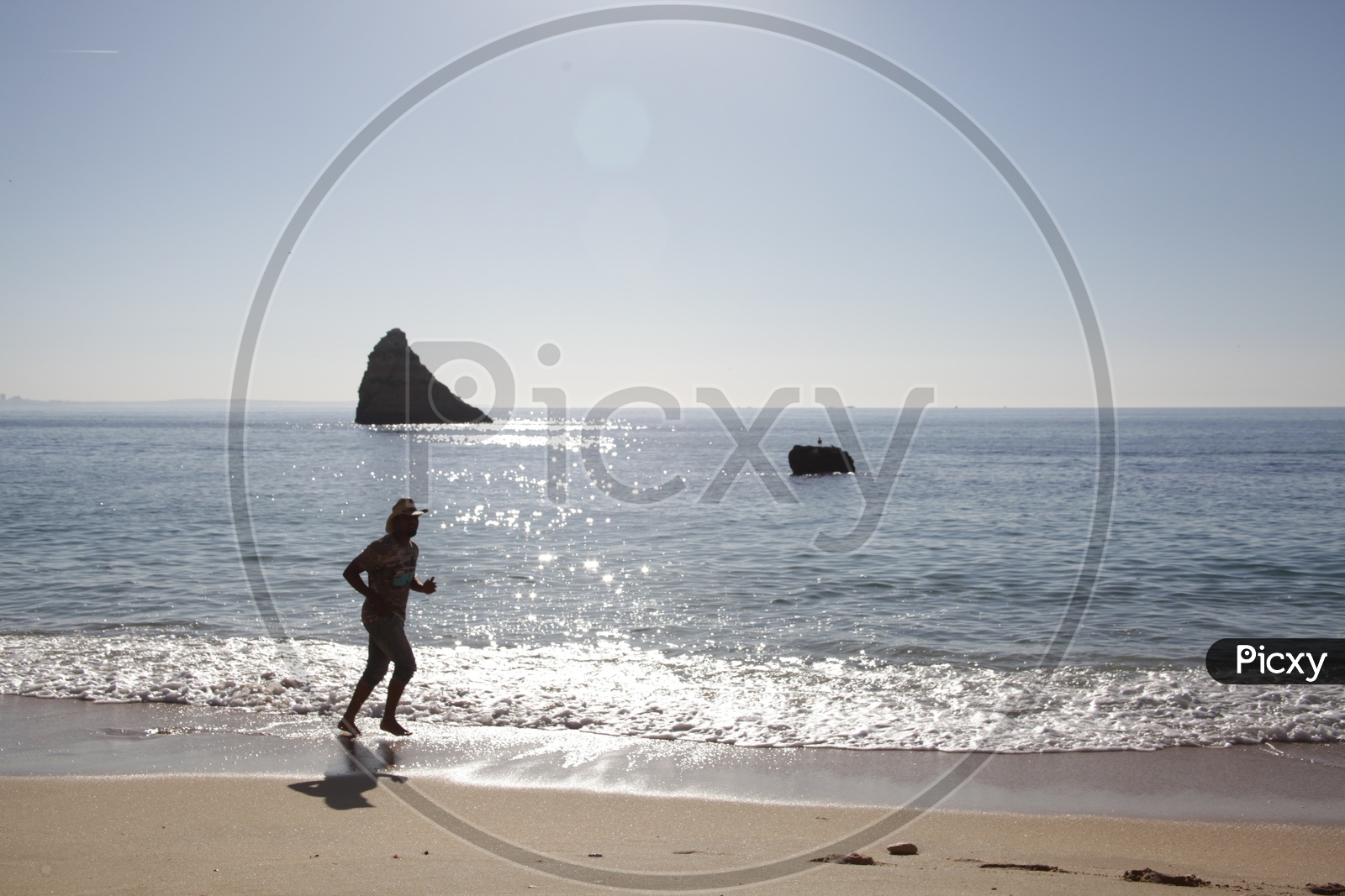 A Man Running In a Beach