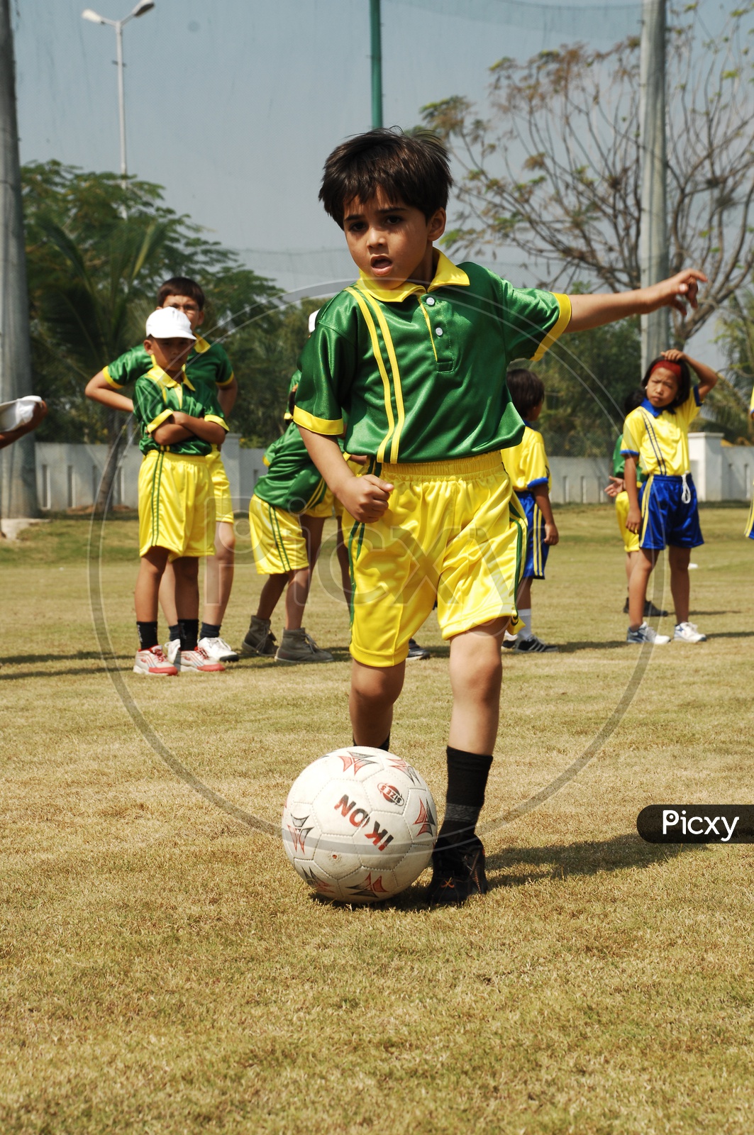 image-of-school-children-playing-football-in-a-football-court-id476297