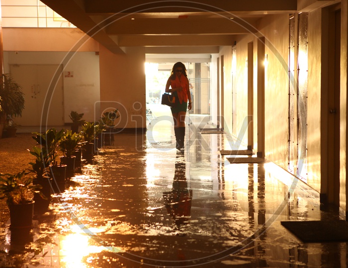 Silhouette Of a Woman Walking In a Corridor