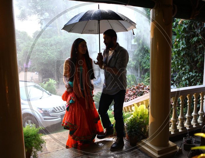 Young Couple Lovers Under an Umbrella