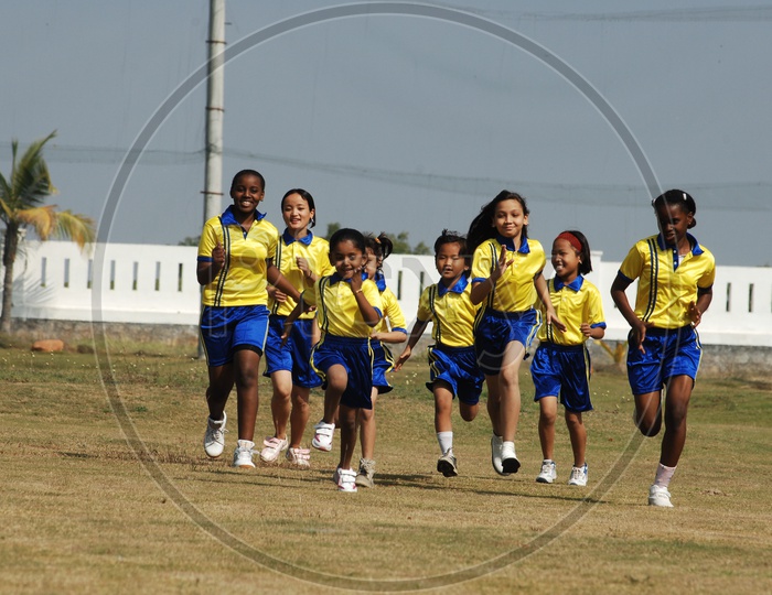 Girl Children Participating In a Running Race