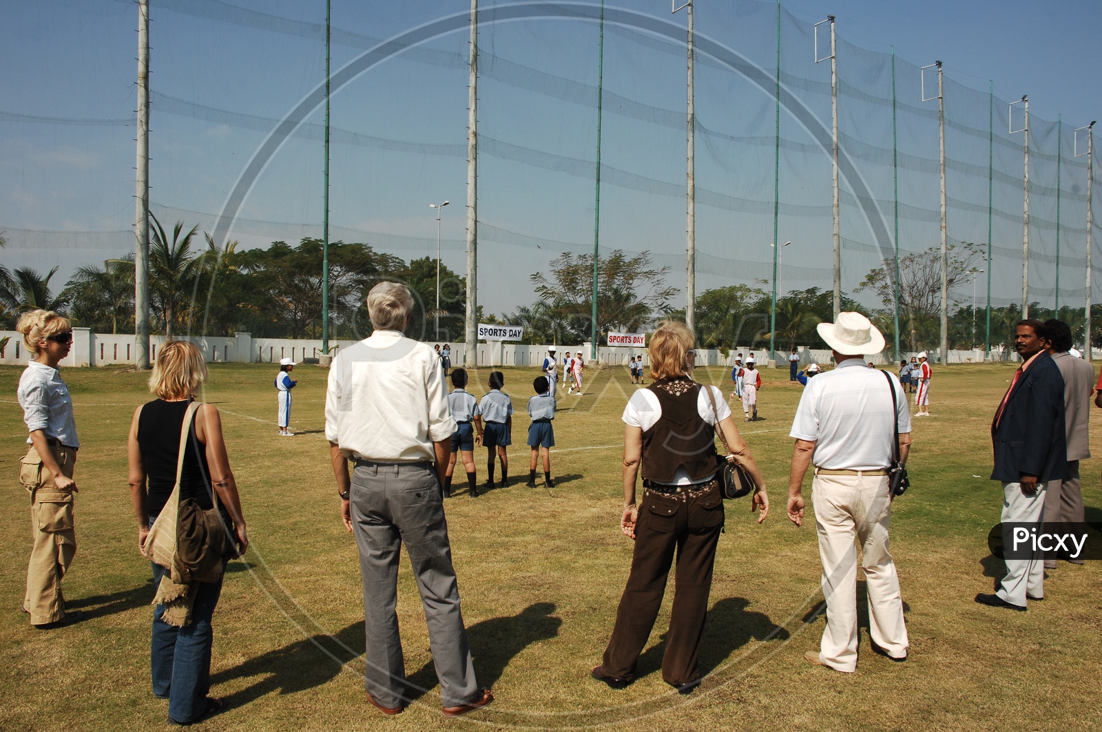 Parents Encouraging Children Ina  Baseball Match