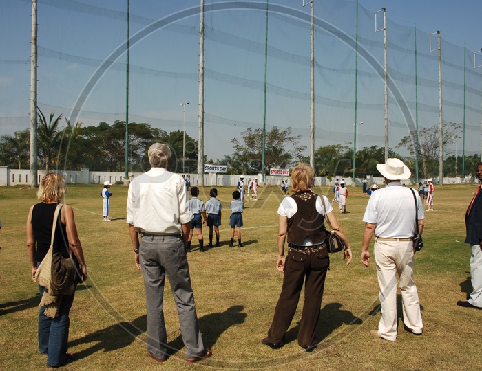 Parents Encouraging Children Ina  Baseball Match