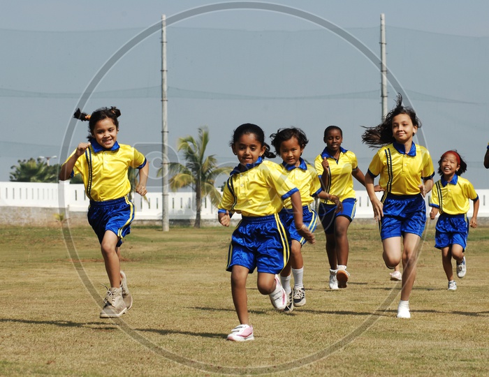 Girl Children Participating In a Running Race