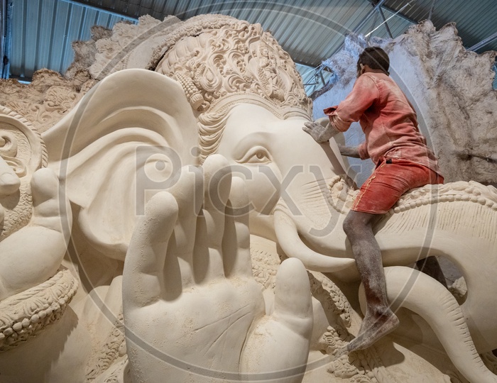 Ganesh Idols Making In Dhoolpet For Ganesh Chathurdhi Festival By Artists Giving Finishing To idols