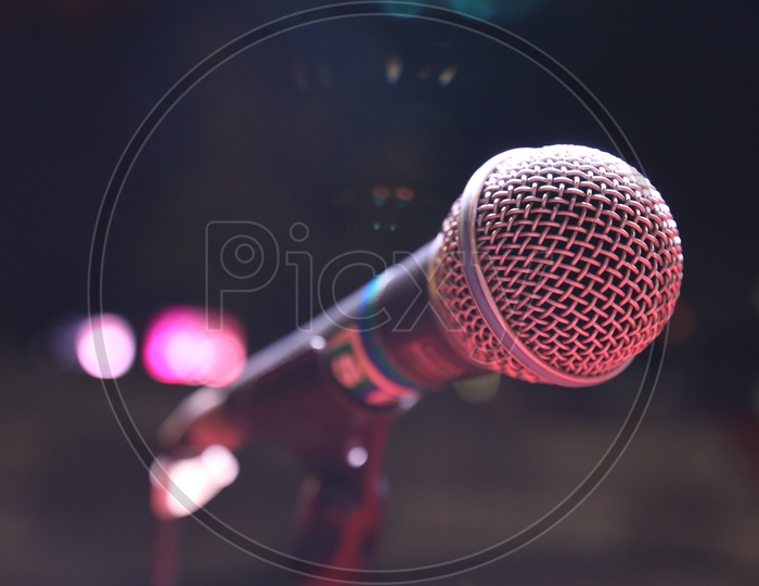 Portable Amplifier Mic Tagged To a Stand On Stage