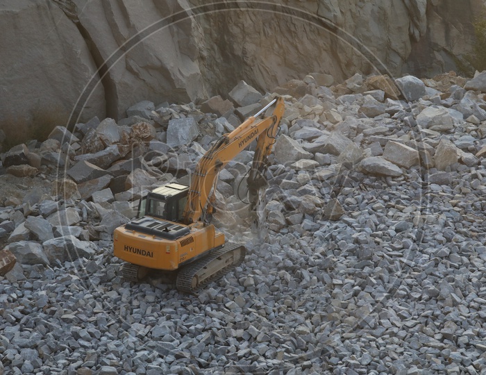 JCB Working In Quarry Carrying Stones