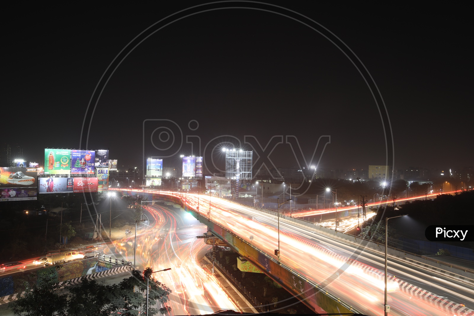 Long Exposure Shot Of Fast Moving Vehicles On Flyover roads And At Hi-Tech City Traffic Signal