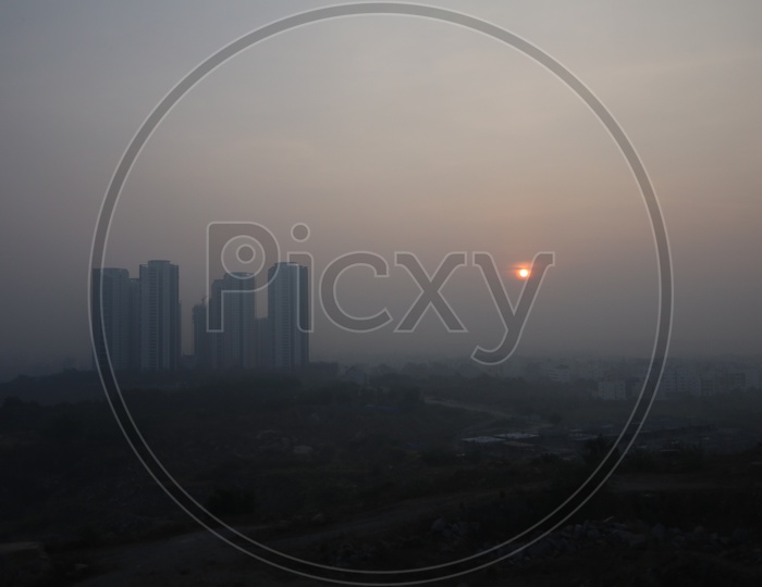 Sunrise Over a City Scape With High Rise Buildings