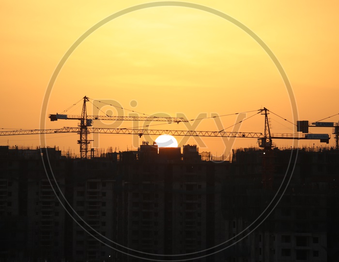 High Rise Apartments Construction with Sun in Background