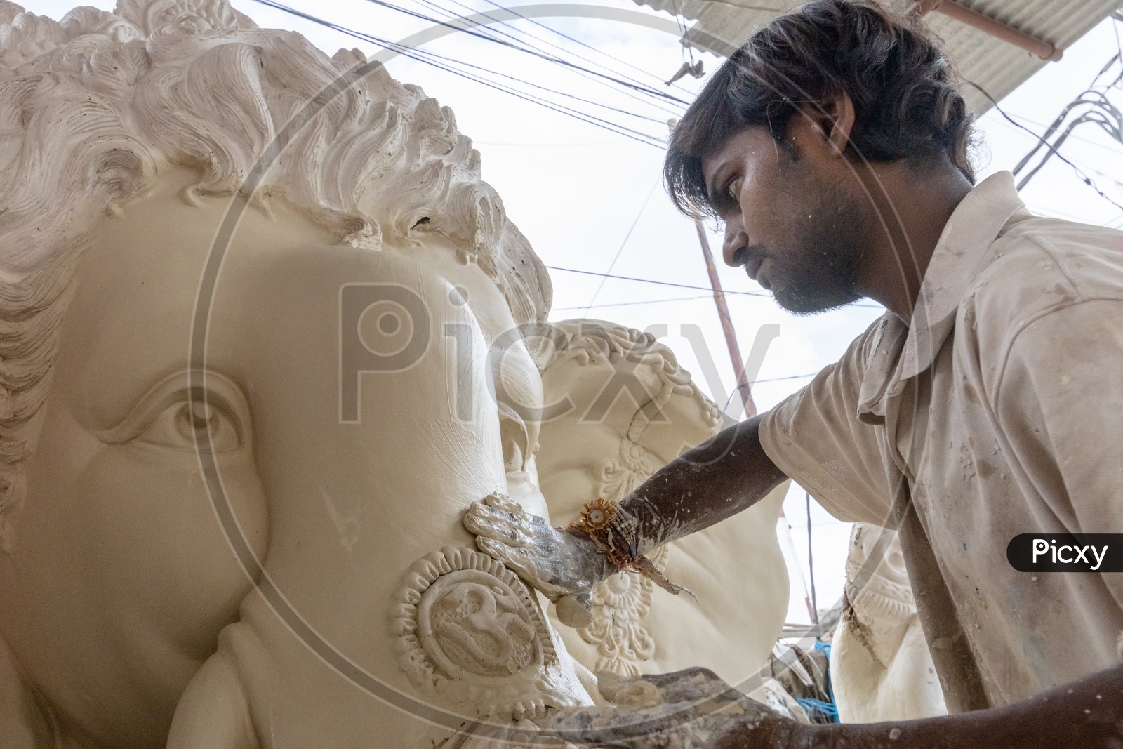 Ganesh Idol Making In Dhoolpet For Ganesh Festival By Artists Giving  Final Finishing   In Workshops