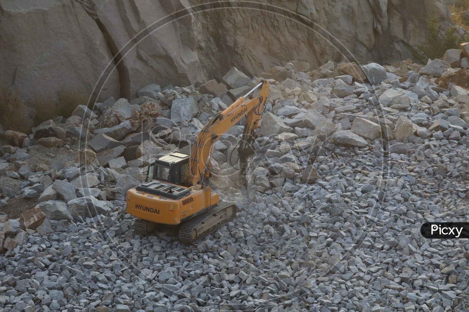 JCB Working In Quarry Carrying Stones