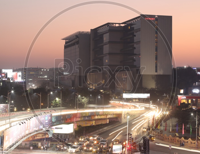 Long exposure   Shot of Fast Moving Vehicles At Hitech City Flyover Signal With Trident Hotel In Background