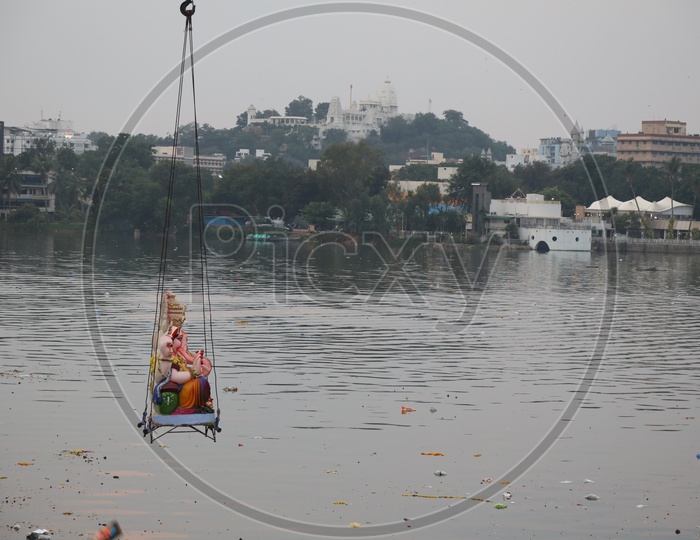Ganesh Idols Visarjan Nimarjanam In Hussain Sagar Lake With Heavy Cranes At Tank Bund During Ganesh Festival