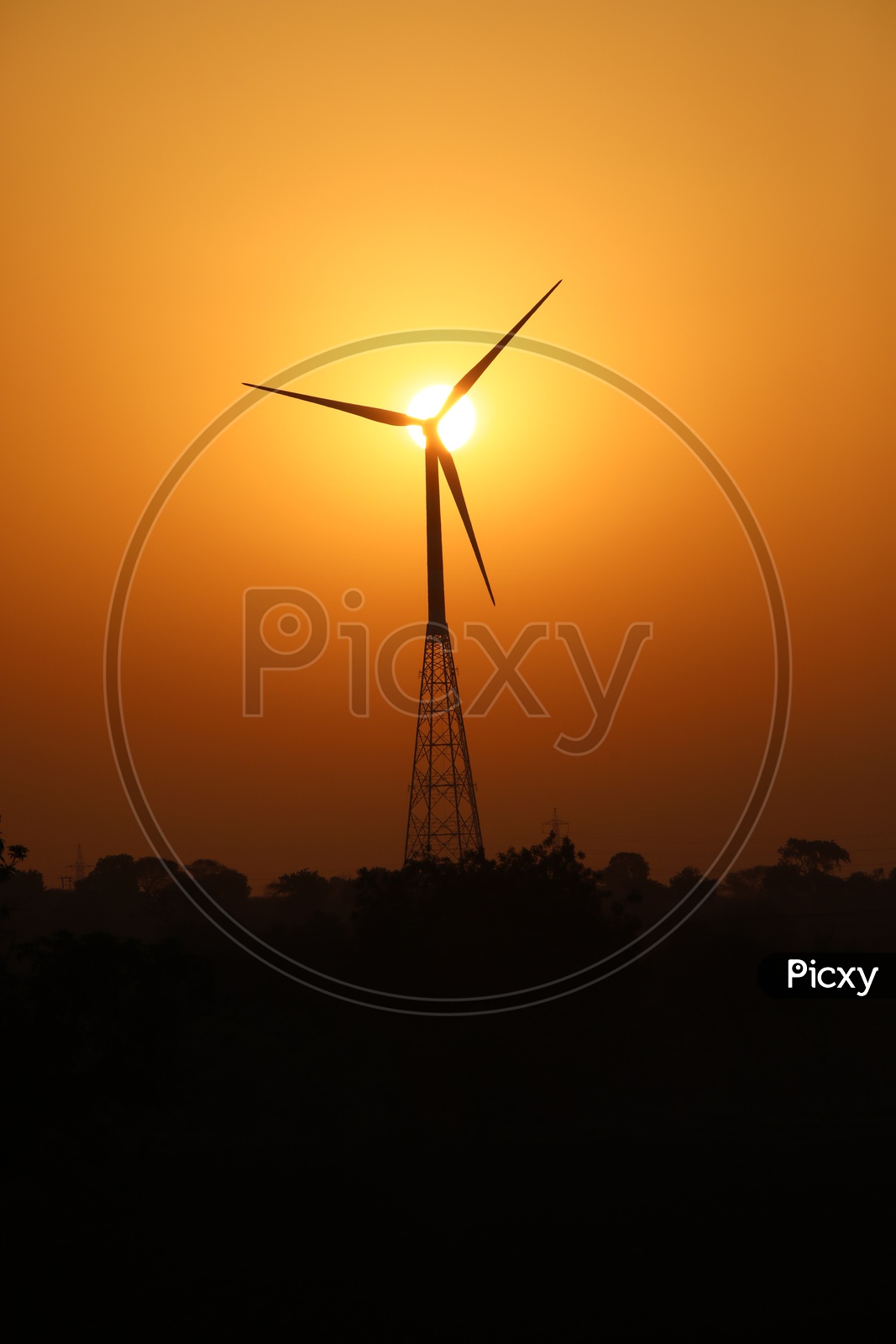 Wind Turbine with Sunset in Background