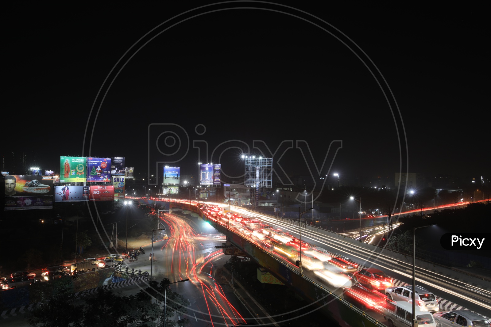 Long Exposure Shot Of Fast Moving Vehicles On Flyover roads And At Hi-Tech City Traffic Signal