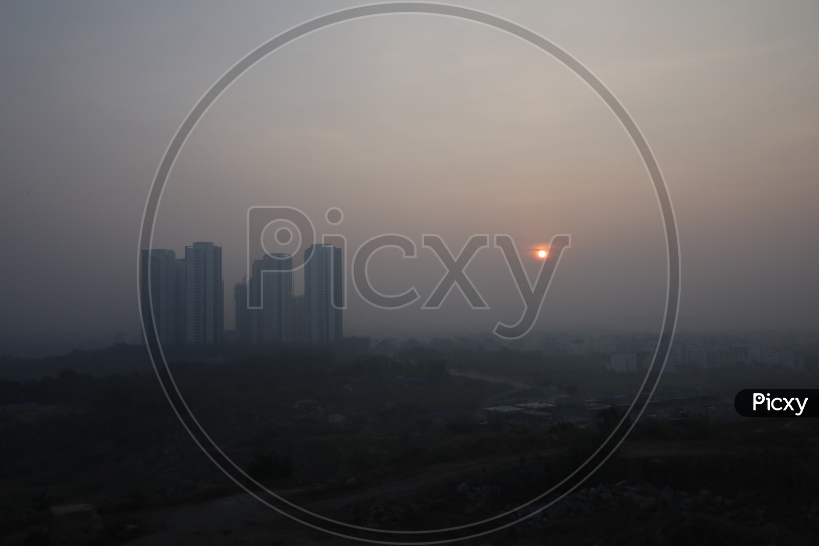Sunrise Over a City Scape With High Rise Buildings